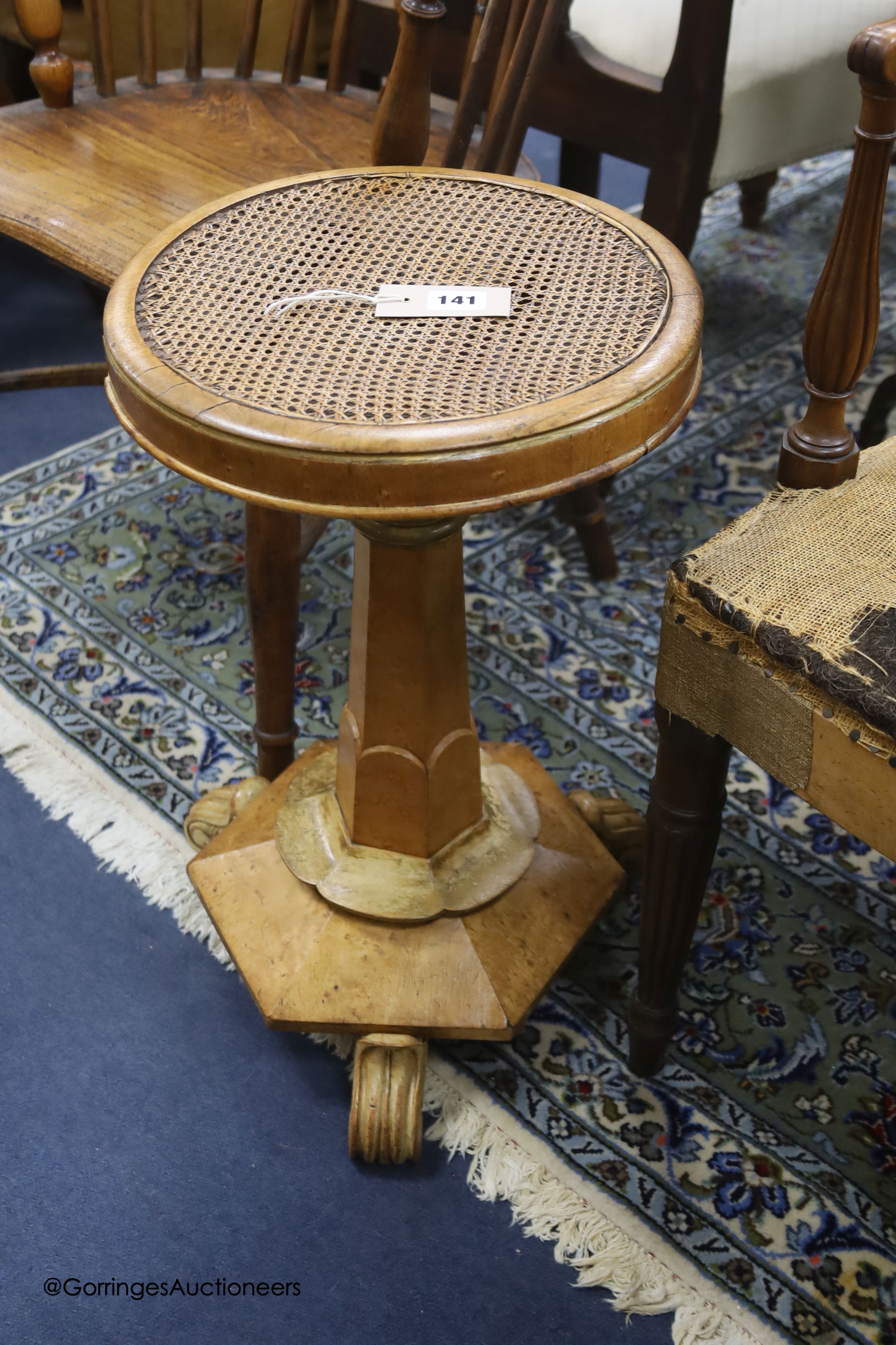 A 19th century bird's eye maple cane seated dressing stool